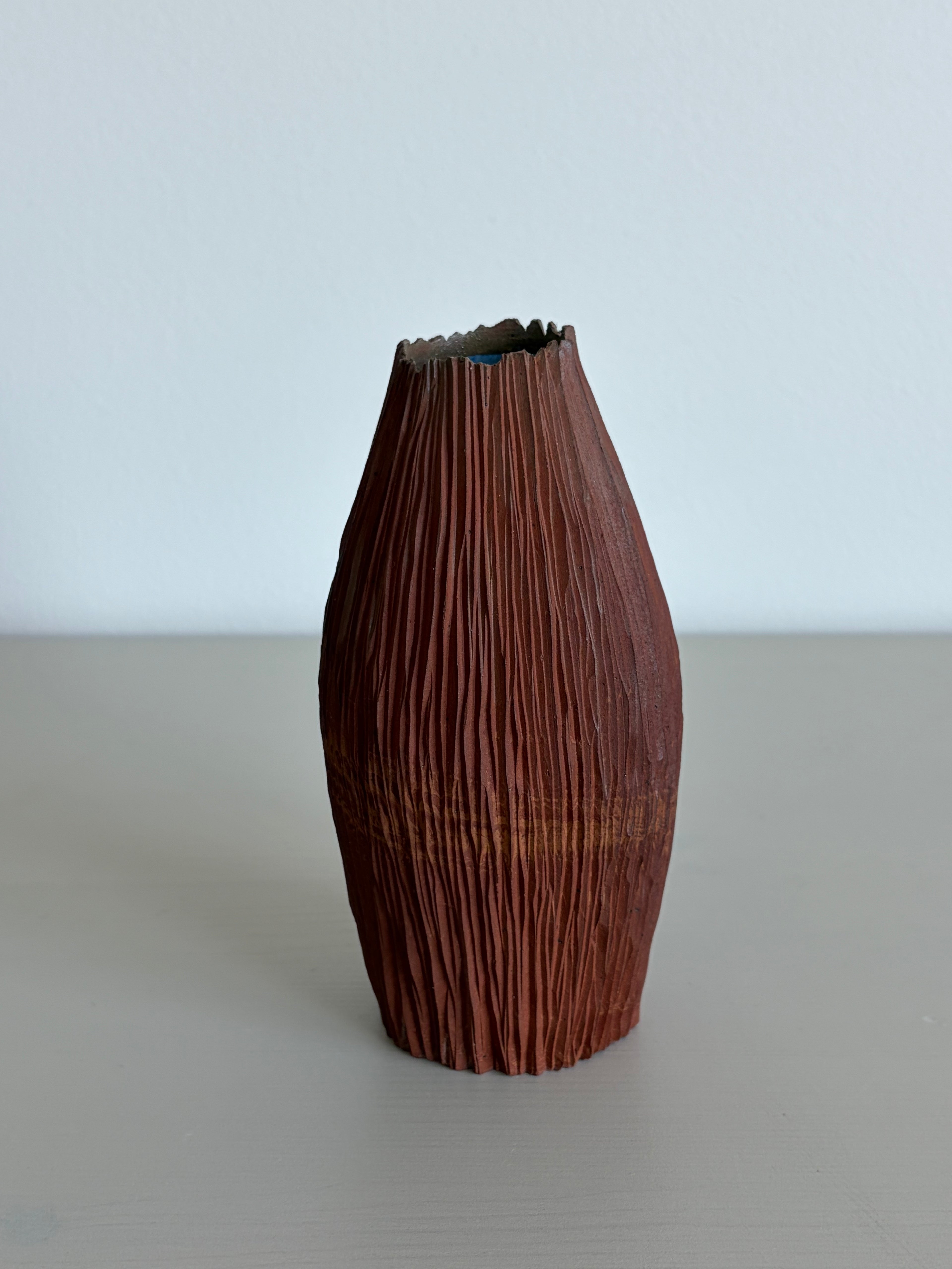 Red seedpod vase