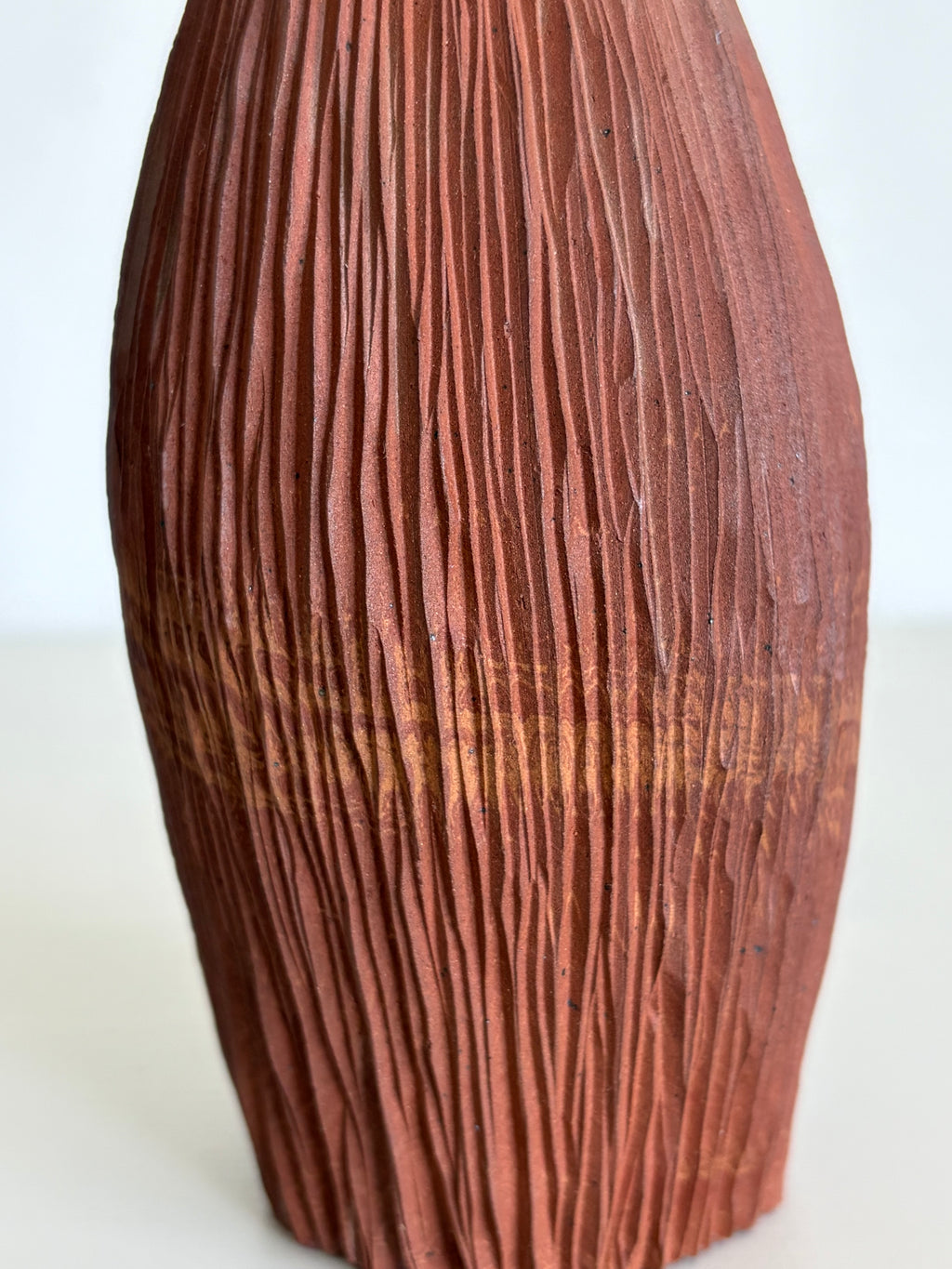 Red seedpod vase